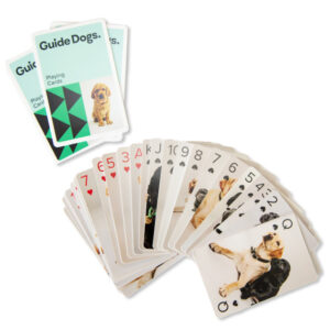 A deck of Playing Cards featuring images of dogs, with Playing Cards shown on the top card of the deck.