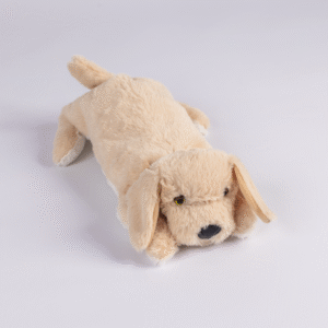 The Plush PJ Puppy, a light brown plush toy dog, lies on a white background facing slightly right with its front legs stretched forward.