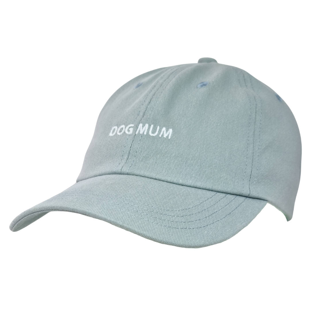 Light blue Caps featuring "DOG MUM" embroidered in white on the front.