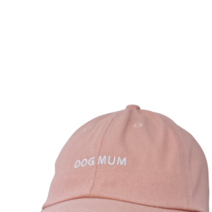 Light pink Caps with white embroidered "DOG MUM" text on the front.