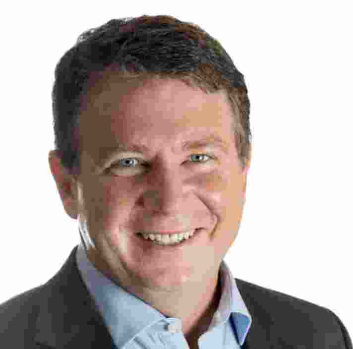 Headshot of Guide Dogs Queensland Board Director, Drew Jackson. Drew is looking at the camera smiling.