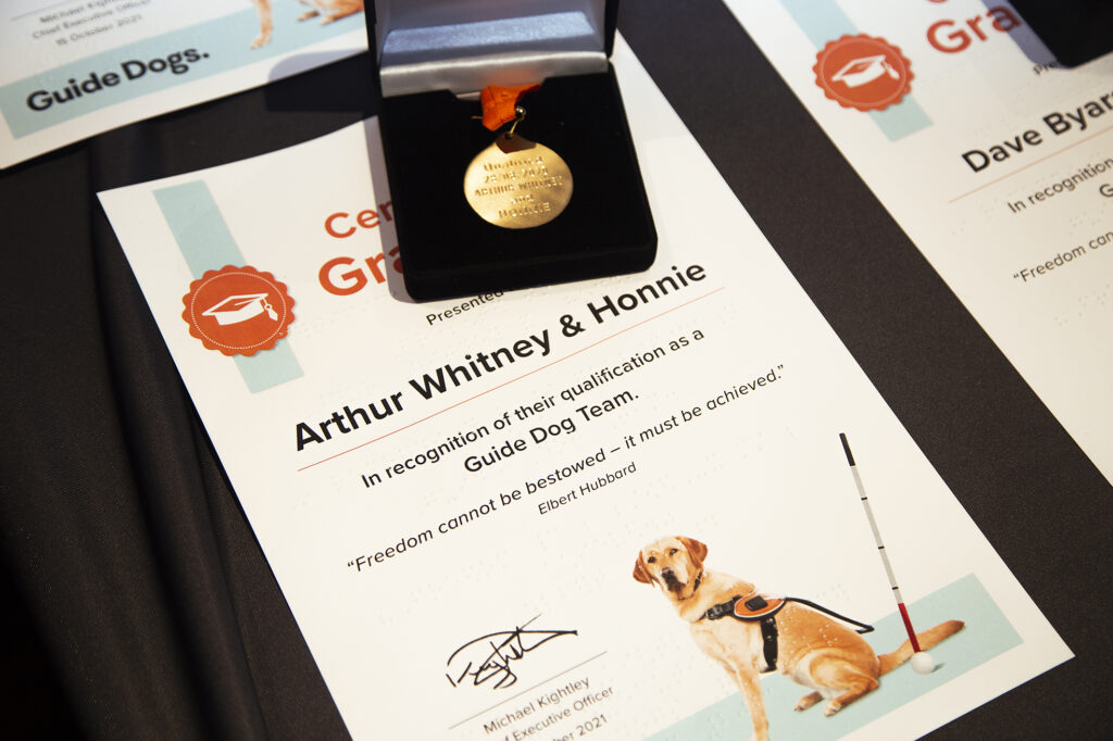 The Certificate and medal for graduates Arthur Whitney and Guide Dog Honnie.