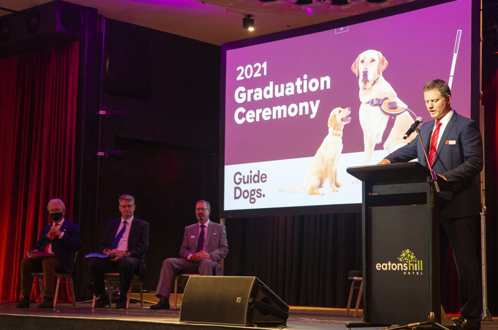 Jock Beveridge making a speech at the graduation.