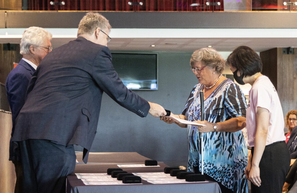 Linda Ovenden on the right, former Governor, the Honourable Paul de Jersey AC CVO, and David Swain on the left.