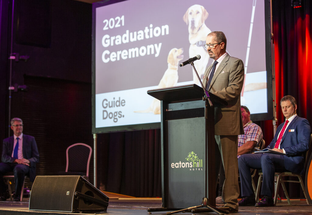 Michael Kightly making a speech at the graduation.