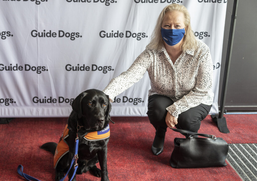 Joanne Hardy from RACQ and Trainee Support Dog Kobe.
