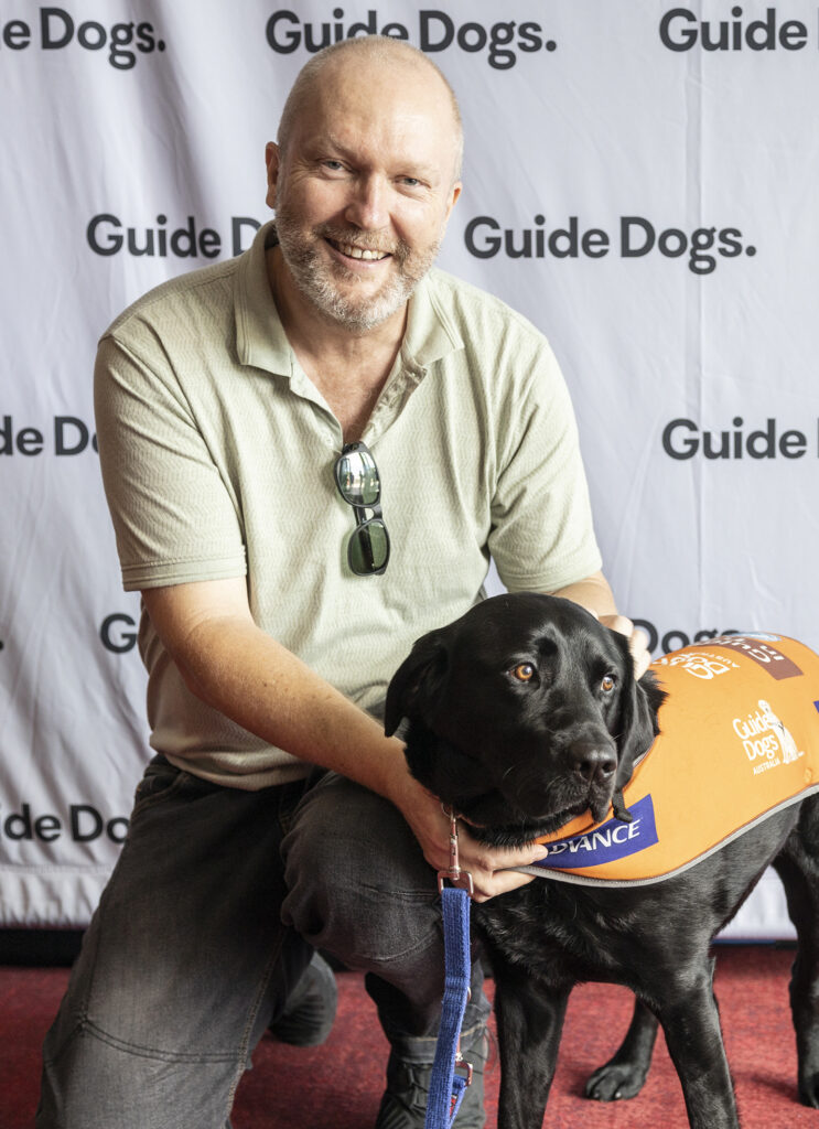 Trainee Support Dog Kobe getting pats at Graduation.