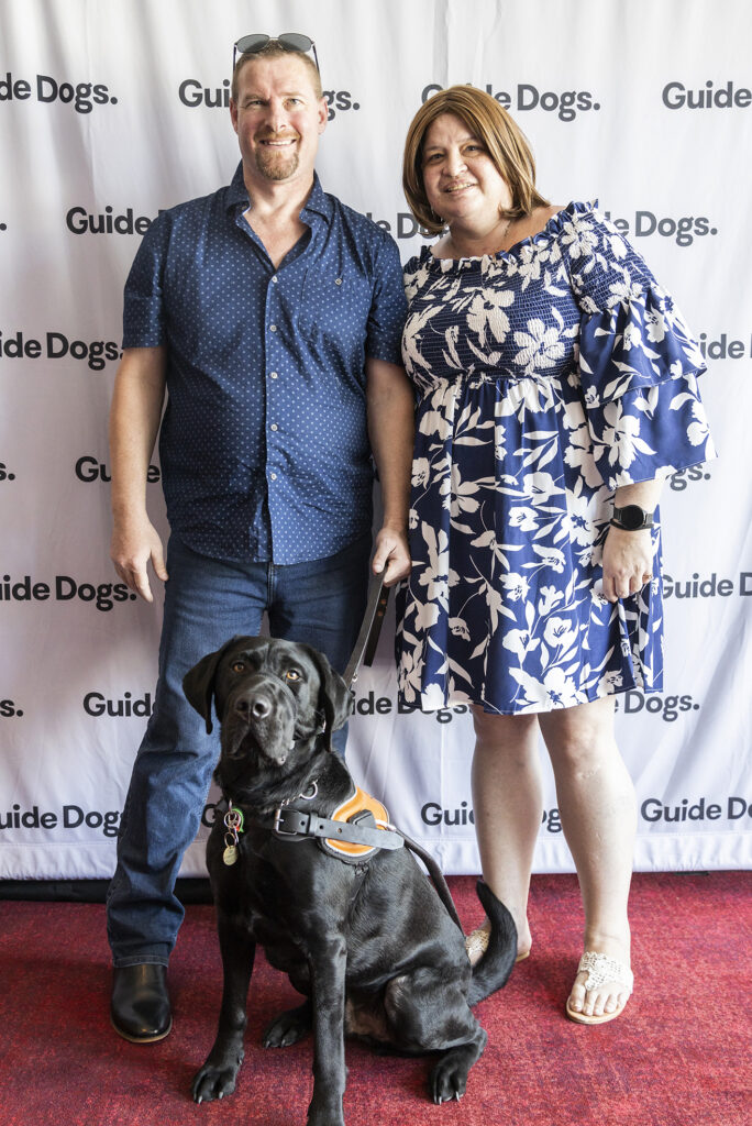 Tim Ray, Guide Dog Granger and partner Anna.