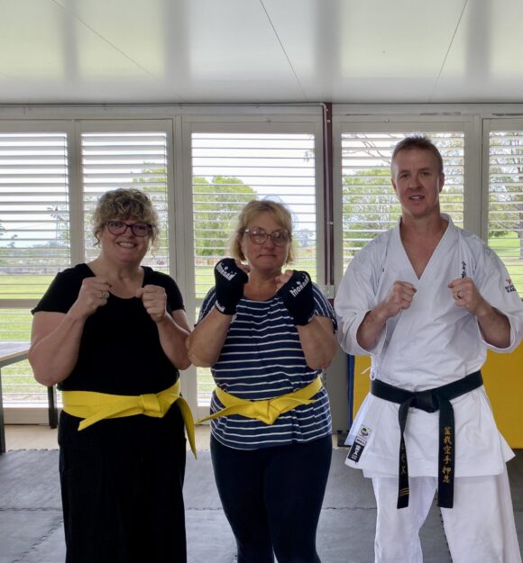 A group of people in a self defence class.