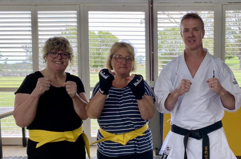 A group of people in a self defence class.