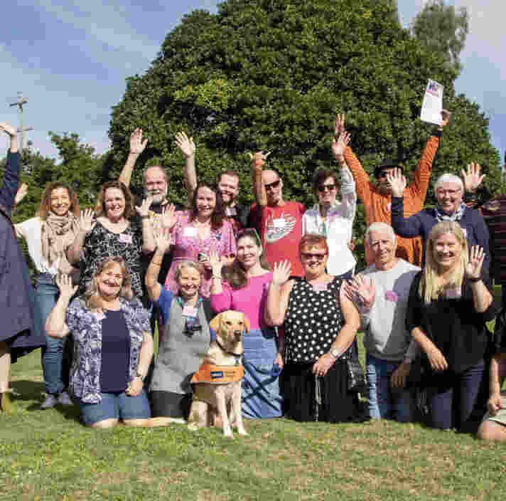 Image shows the 3-year volunteer group photo with Ambassador Dog Vanda
