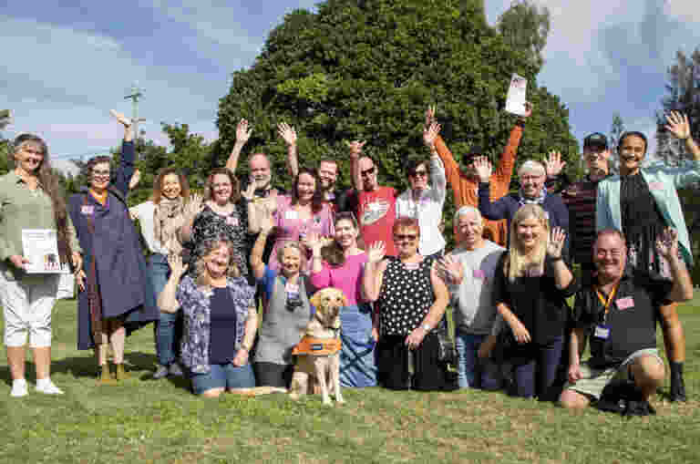 Image shows the 3-year volunteer group photo with Ambassador Dog Vanda