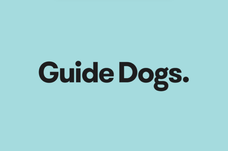 Black text on a blue background reads "Guide Dogs."