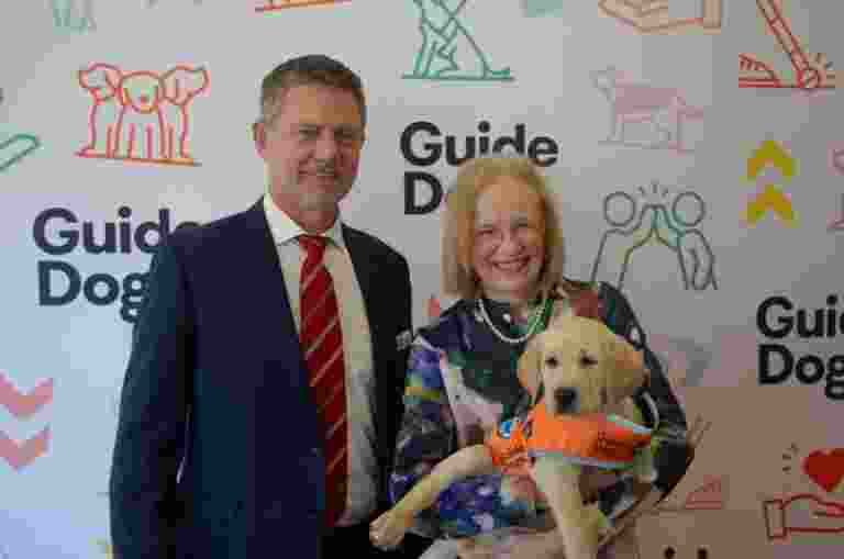 Guide Dogs Queensland CEO Jock Beveridge standing next to Her Excellency the Honourable Dr Jeannette Young, Governor of Queensland.