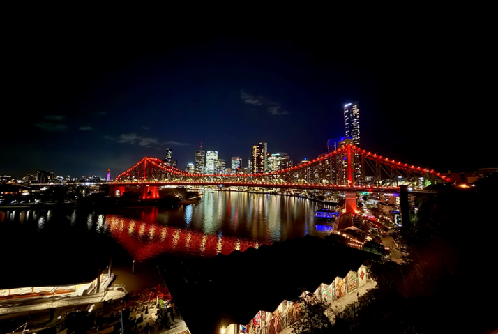 Image shows Brisbane’s Story Bridge glowing orange at night, symbolising support for Guide Dogs and their role in fostering independence and accessibility.