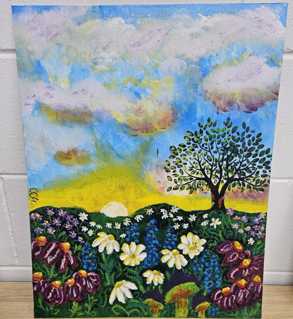 Image shows a vibrant impressionist-style sunrise over rolling hills, with a tree on the right and colorful wildflowers in the foreground, symbolizing renewal and hope.