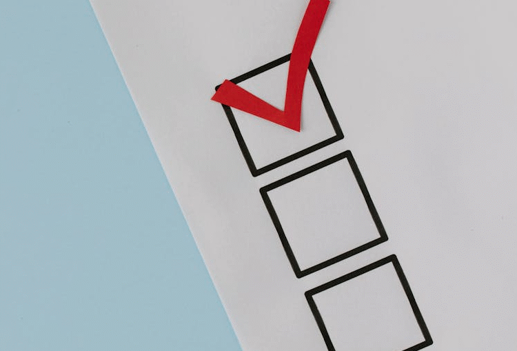 Image shows three check boxes on a piece of paper. One has been ticked.