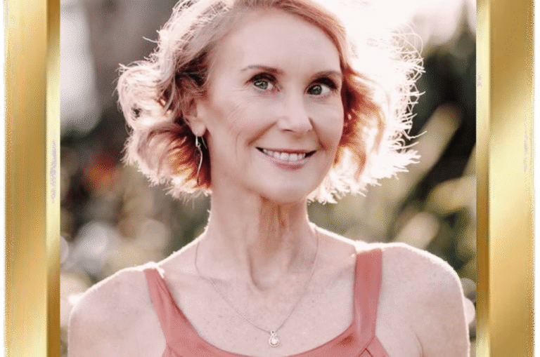 Image shows Joanne with short curly hair and a gentle smile, captured in warm natural light and framed by a gold border.
