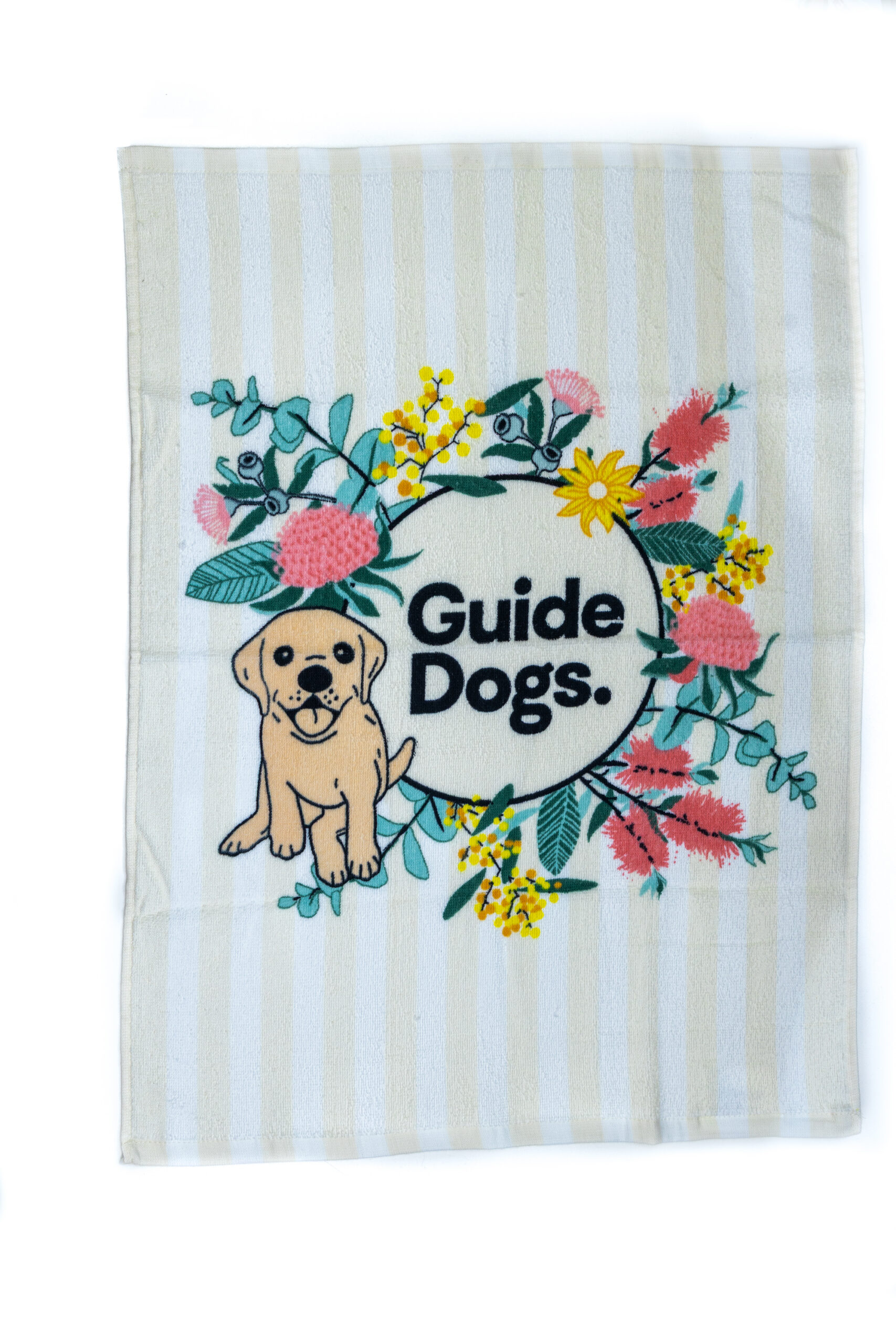 A tea towel with a floral pattern in the centre as well as a Guide Dogs logo with a puppy.